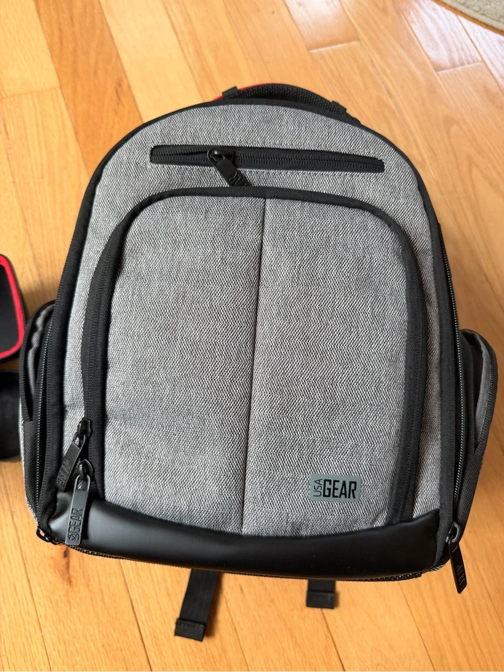 Opteka fish eye camera lens with case and camera lens organization backpack.